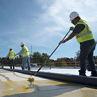 roofers installing a TPO roof