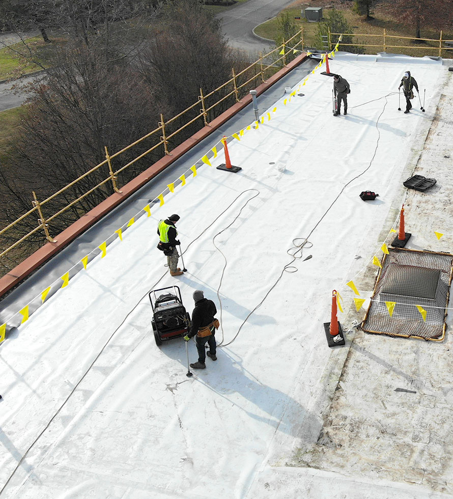 crew installing a flat roof