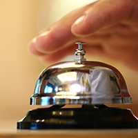 ringing the bell at a hotel lobby