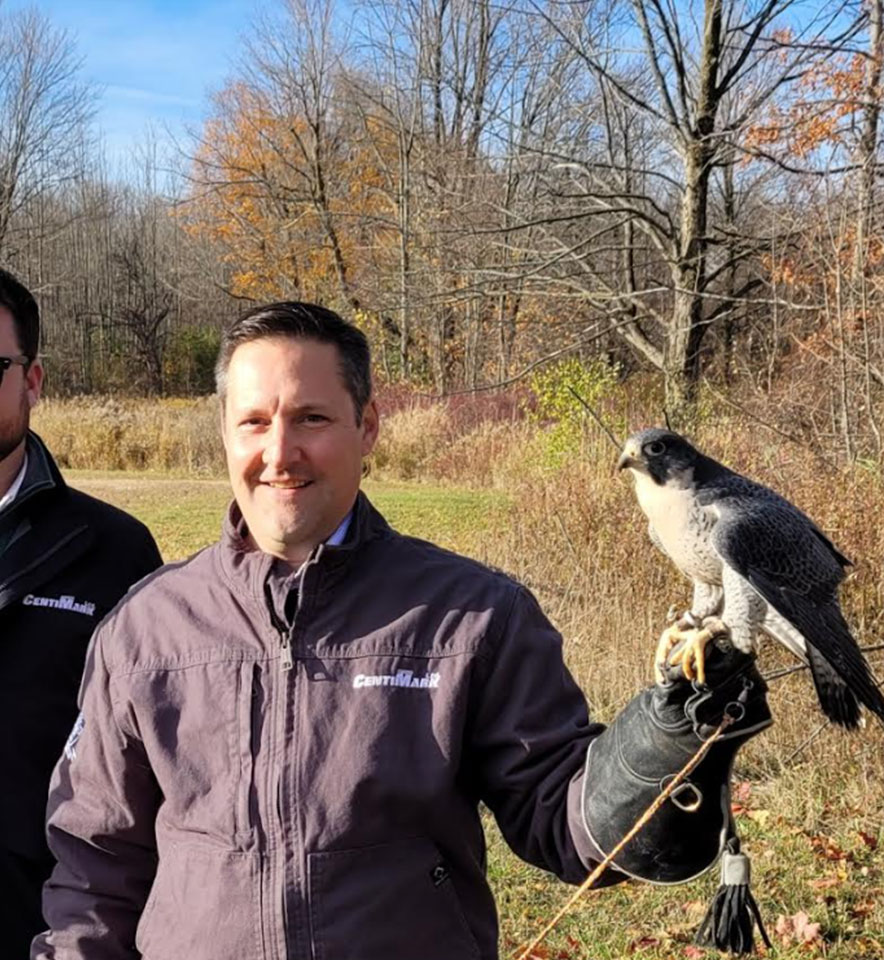 CentiMark employee holding a falcon