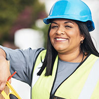 female construction foreman smiling at the camera