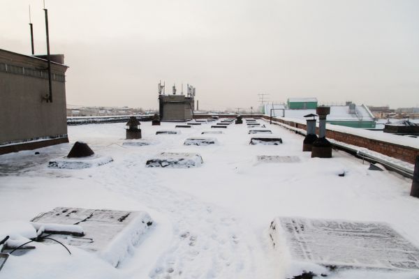 snow on a flat commercial roof